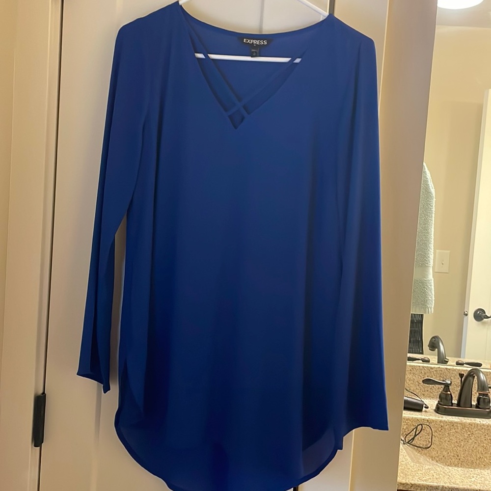 Express silky blouse with crisscross kneckline.